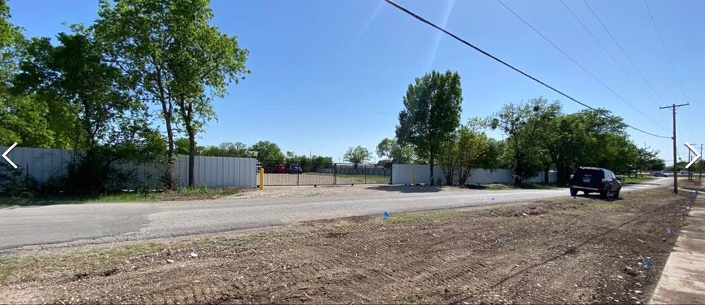 3335 Springfield Avenue Lancaster, TX 75134 - Photo 2 of 5 a backyard of a house with table and chairs
