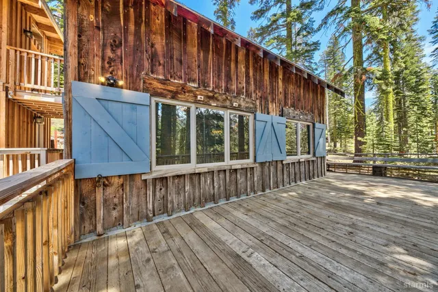 a view of a wooden fence and a pathway