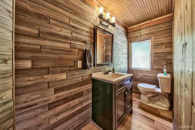 a view of bathroom with a sink and mirror