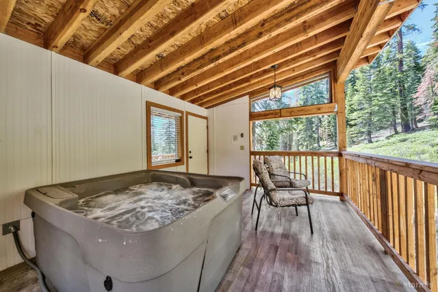 a balcony with furniture and wooden floor