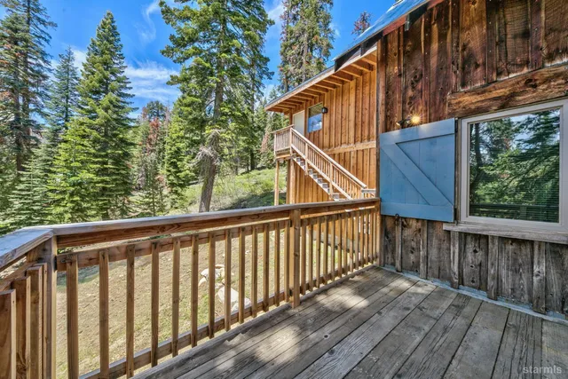 a balcony view with wooden fencing
