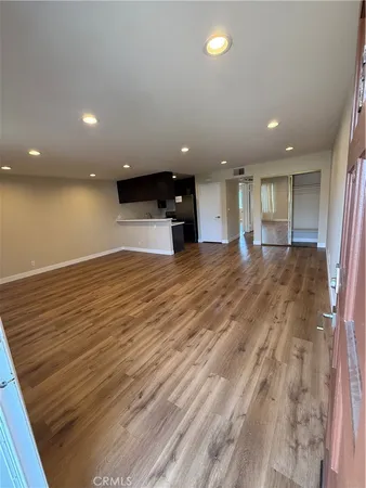 a view of a kitchen with a sink and cabinets