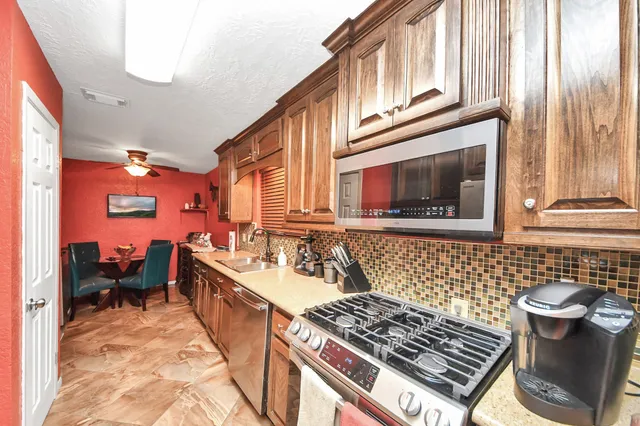 a kitchen with a stove and a sink