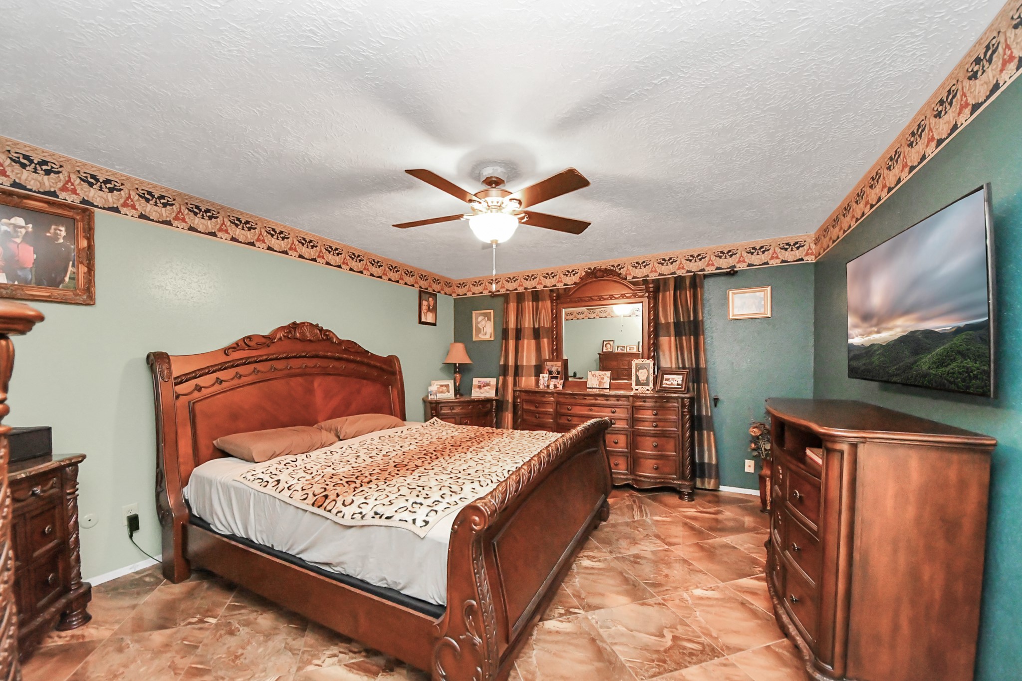 37 Wagon Ln Loop Angleton, TX 77515 - Photo 22 of 42 a bedroom with a bed and window