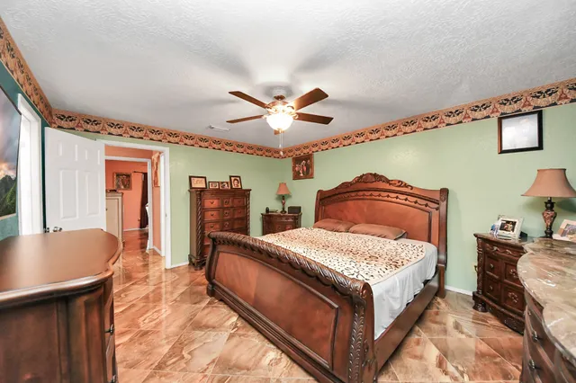 a bed room with a bed and a chandelier