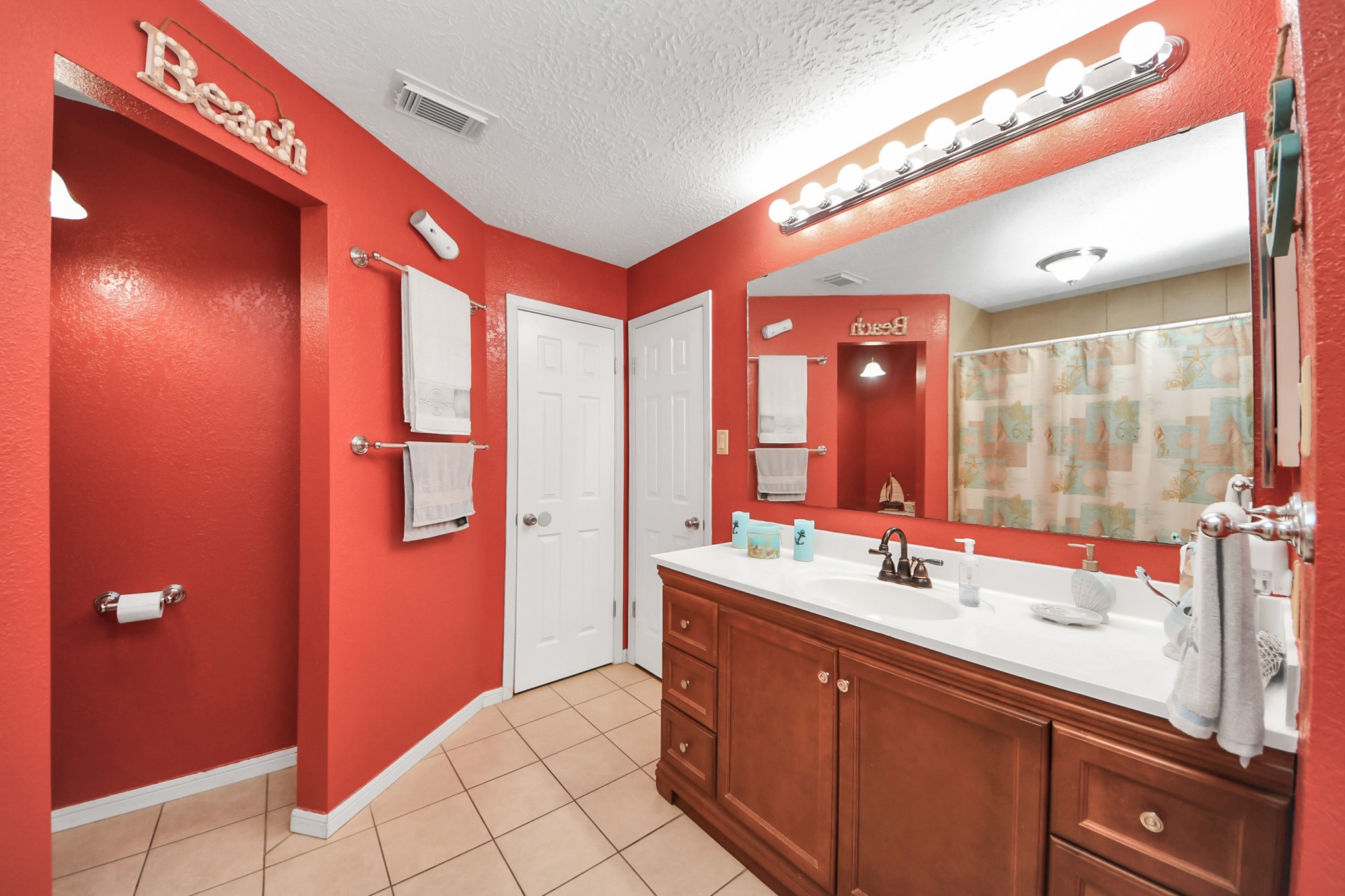 37 Wagon Ln Loop Angleton, TX 77515 - Photo 26 of 42 a bathroom with a double vanity sink and mirror
