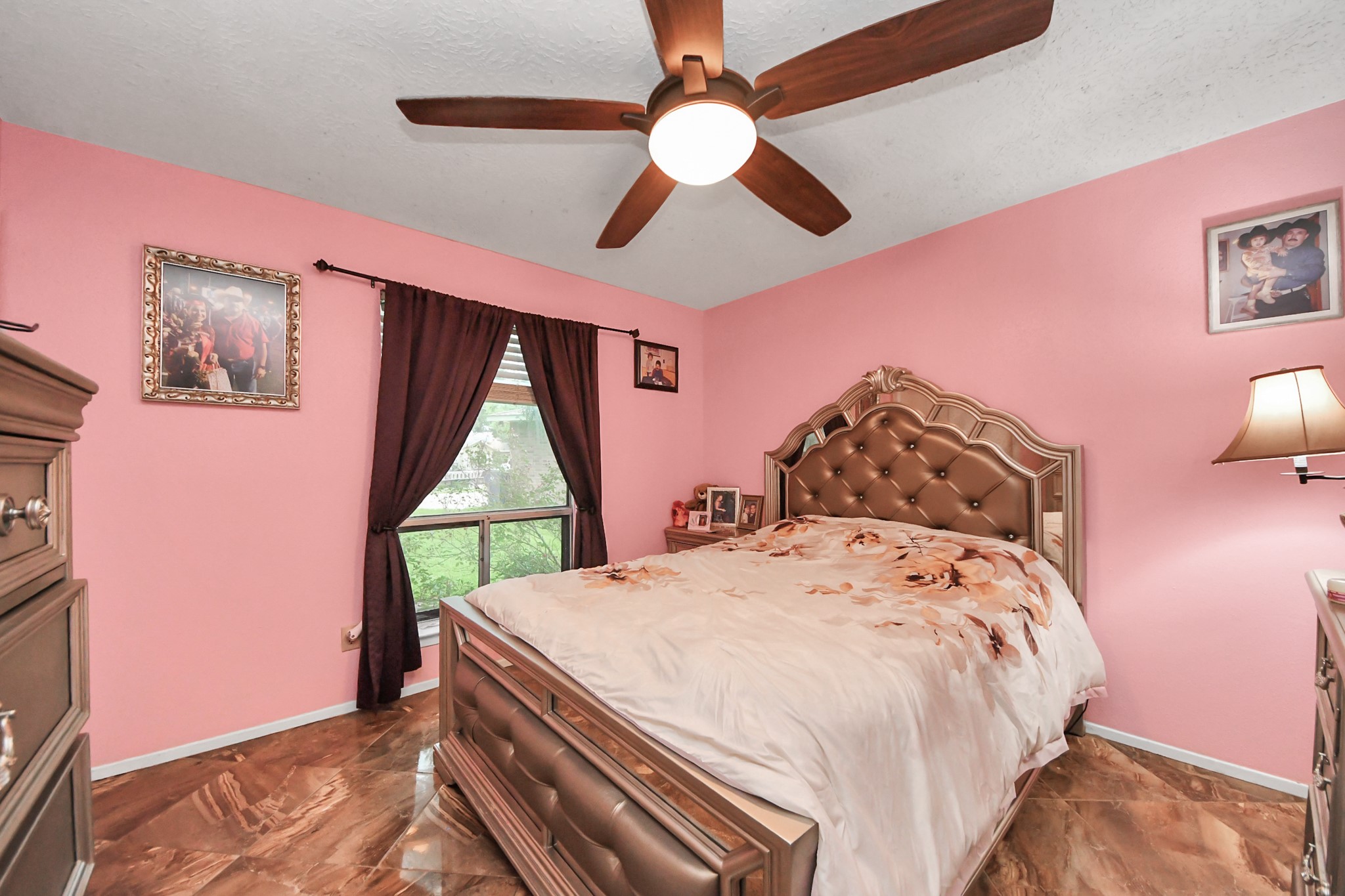 37 Wagon Ln Loop Angleton, TX 77515 - Photo 27 of 42 a bedroom with a bed and a window
