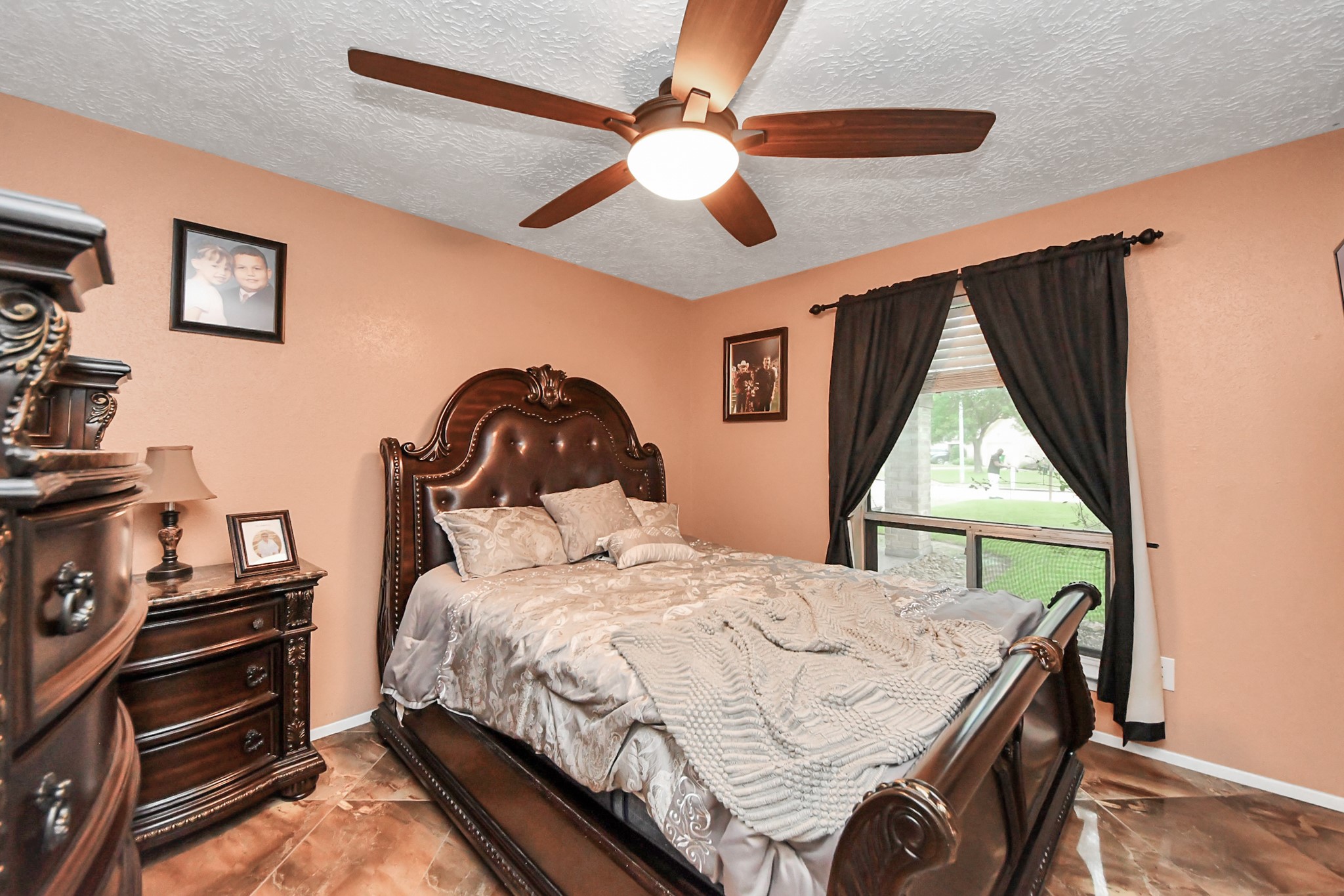 37 Wagon Ln Loop Angleton, TX 77515 - Photo 29 of 42 a bedroom with a bed and a window