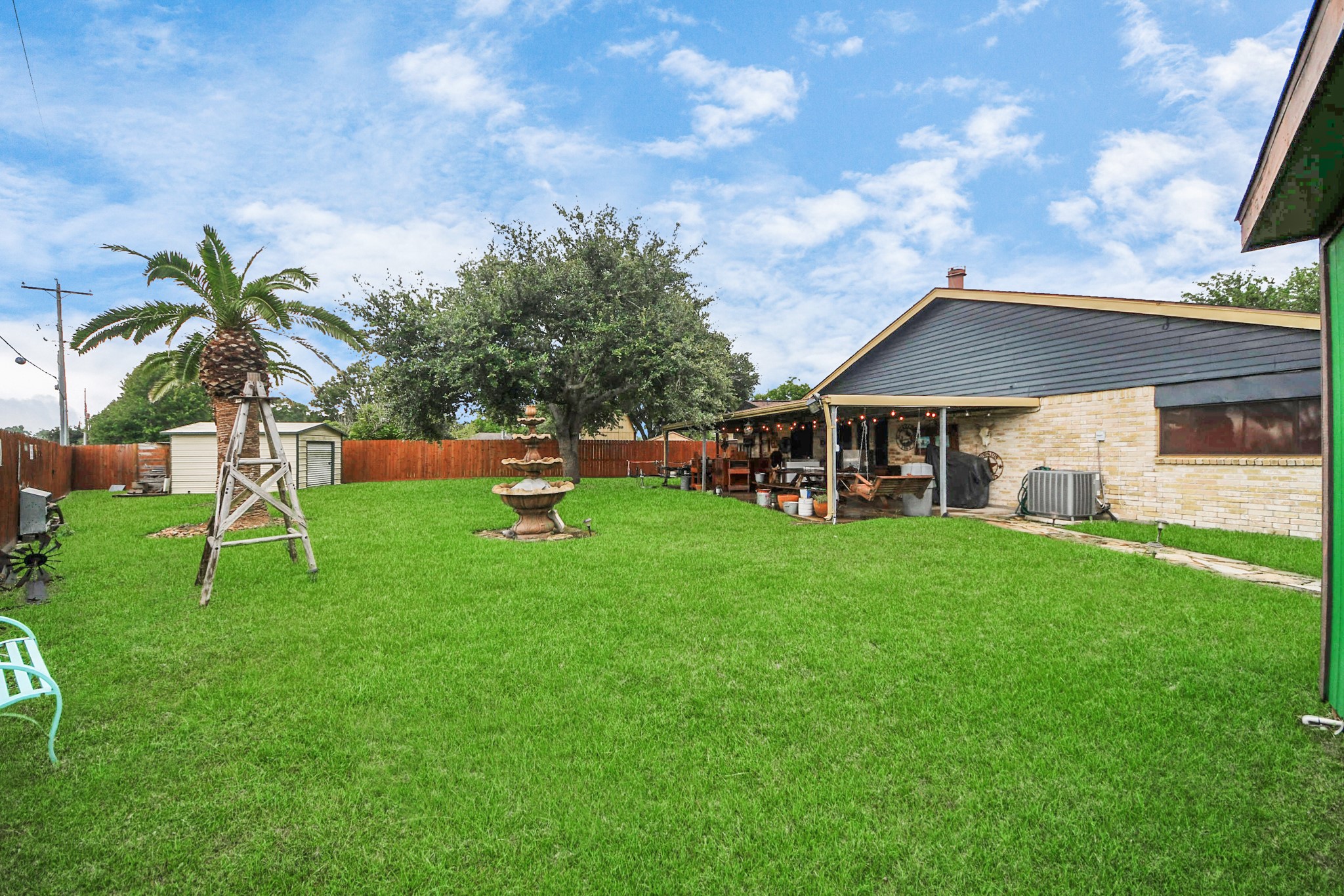37 Wagon Ln Loop Angleton, TX 77515 - Photo 6 of 42 a view of a house with a backyard