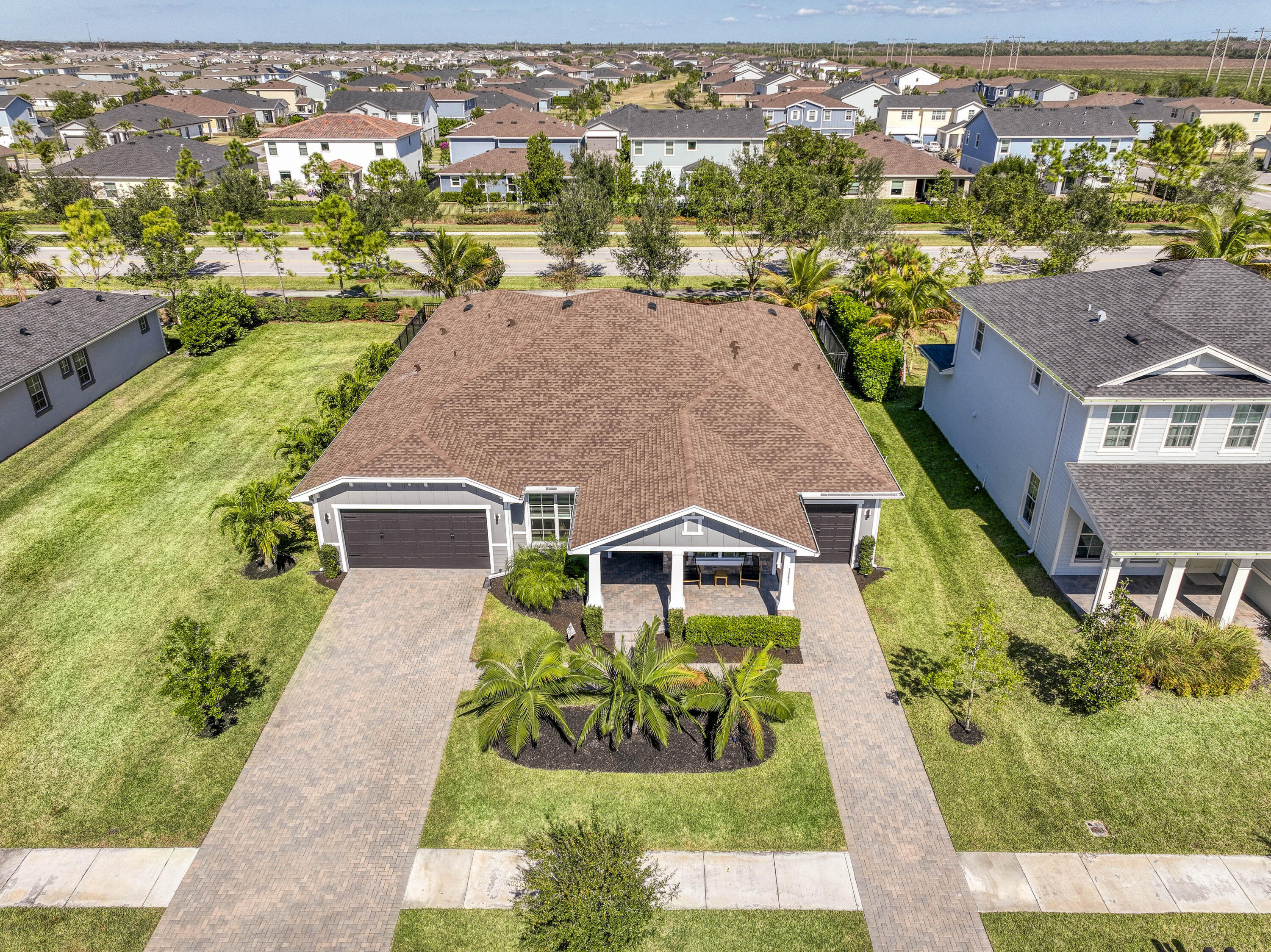 19017 Fly Rod Run Loxahatchee, FL 33470 - Photo 1 of 106 an aerial view of multiple houses with a yard