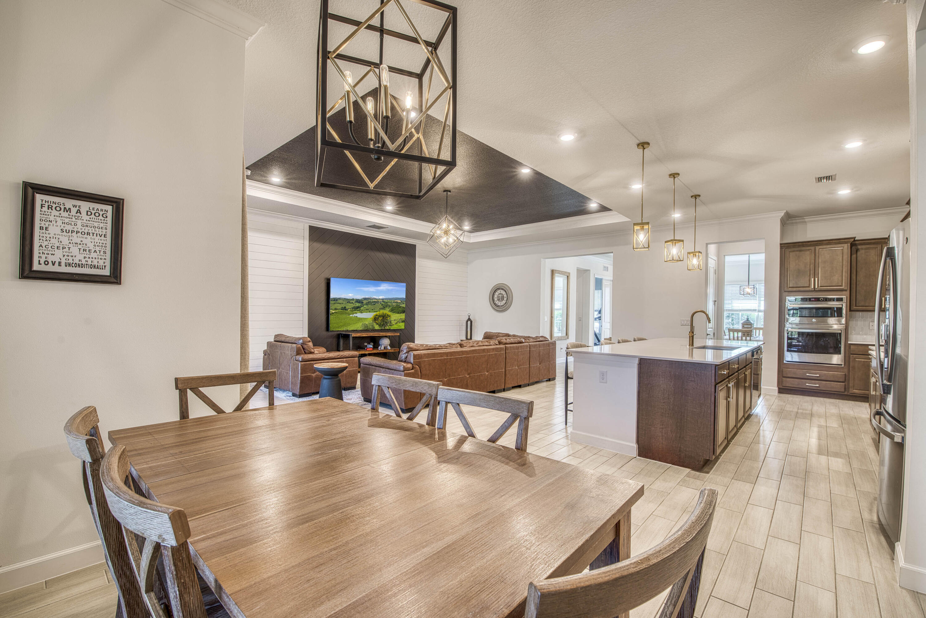 19017 Fly Rod Run Loxahatchee, FL 33470 - Photo 22 of 106 a living room with furniture a wooden floor and kitchen view