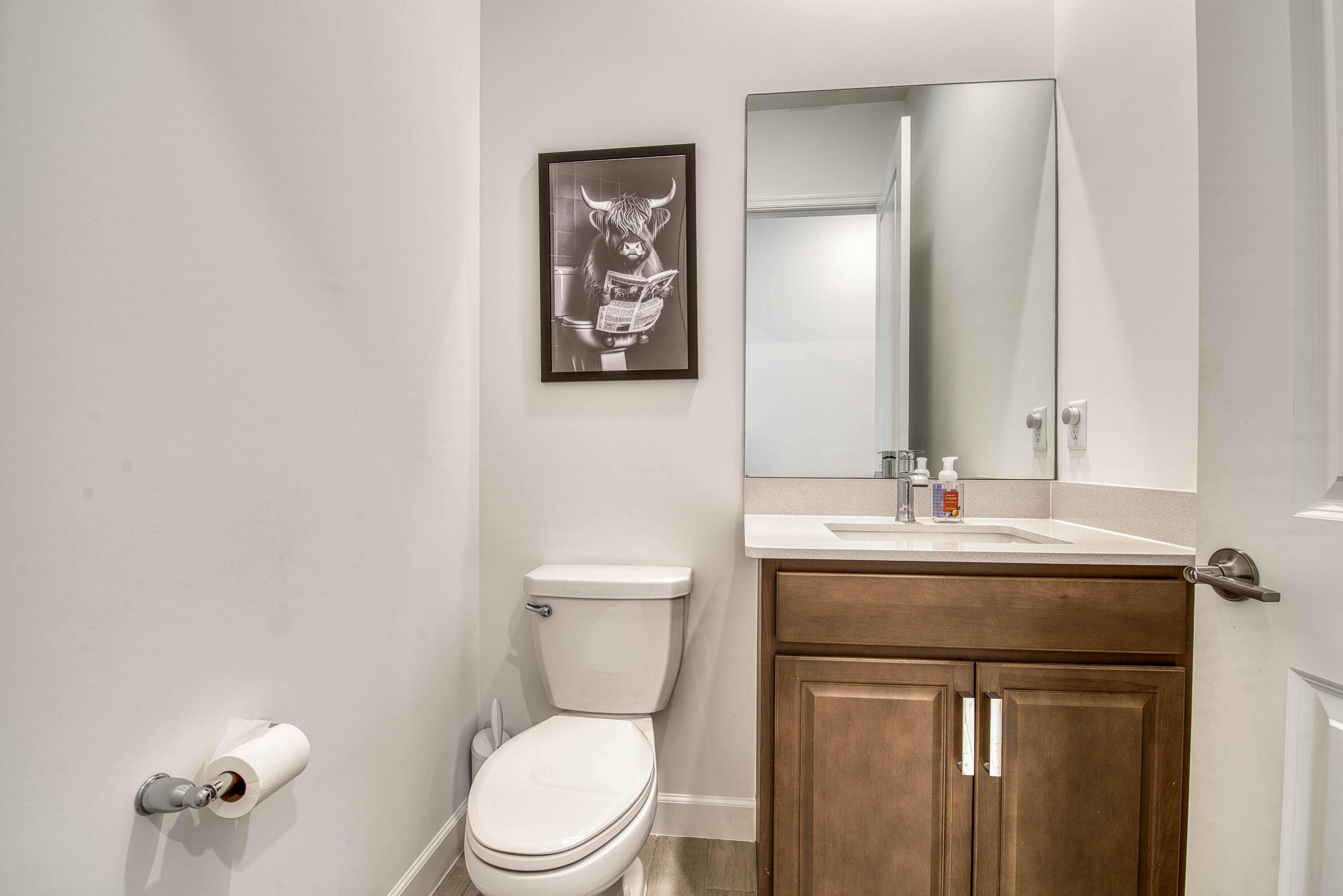 19017 Fly Rod Run Loxahatchee, FL 33470 - Photo 28 of 106 a bathroom with a toilet a sink and mirror