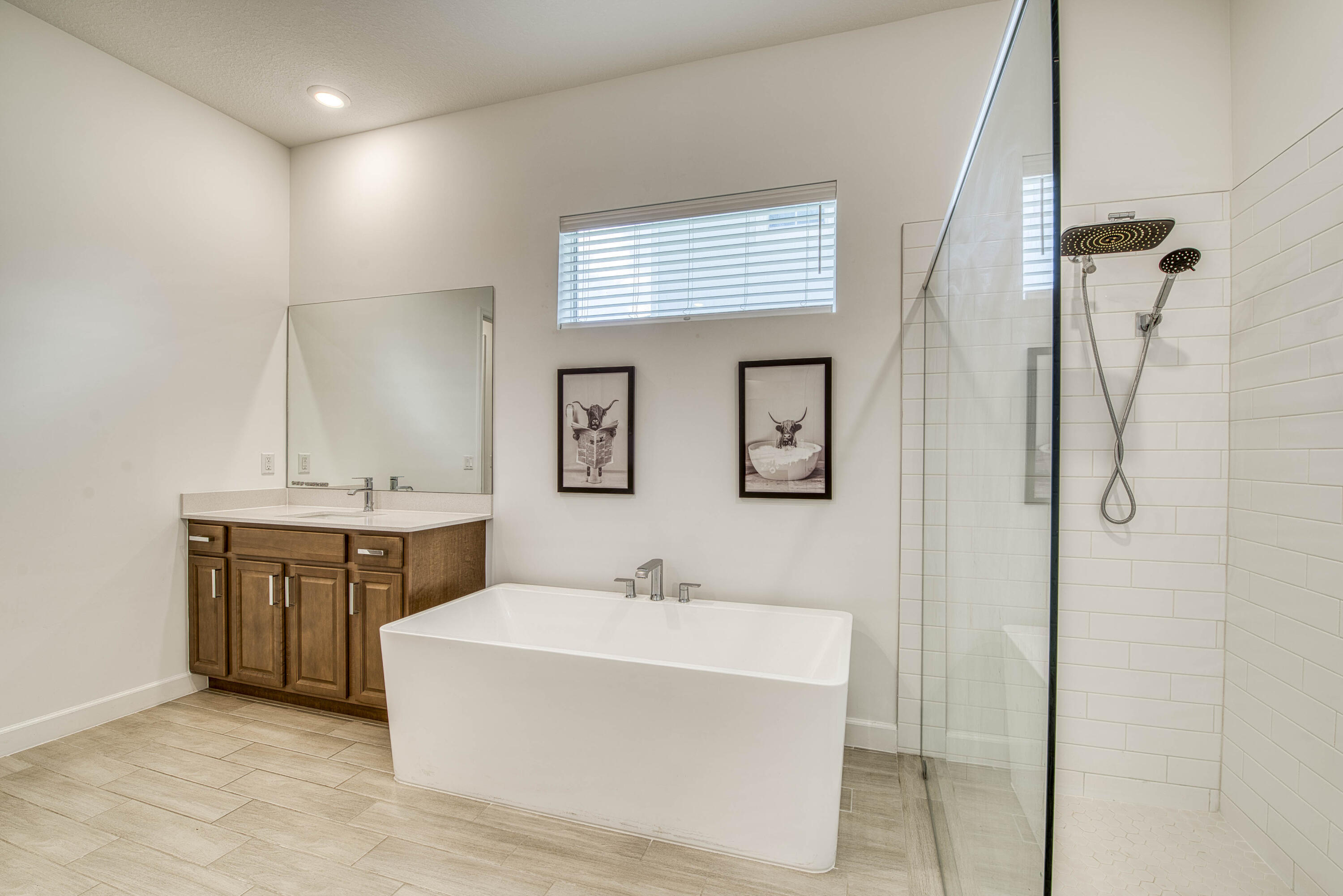 19017 Fly Rod Run Loxahatchee, FL 33470 - Photo 33 of 106 a spacious bathroom with a tub sink and mirror
