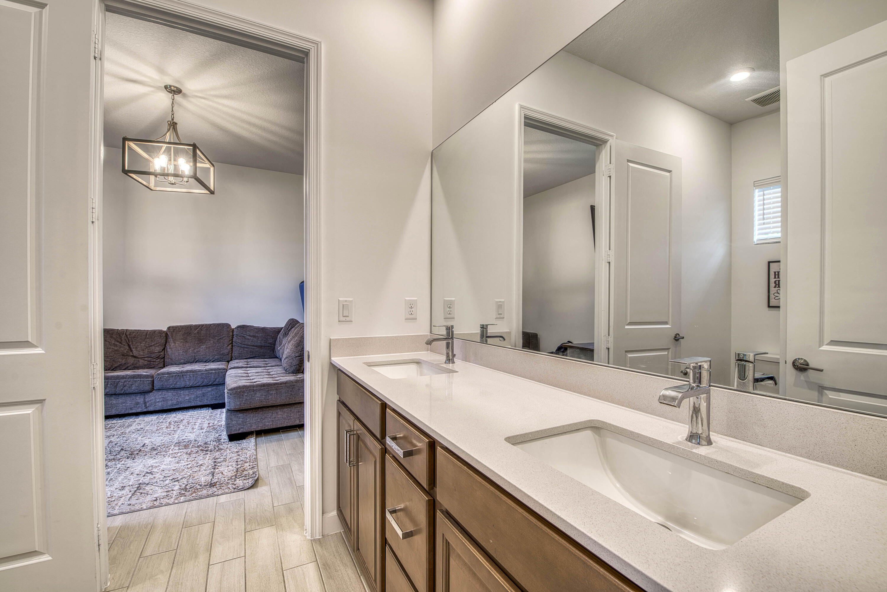 19017 Fly Rod Run Loxahatchee, FL 33470 - Photo 39 of 106 a en suite bathroom with a double vanity sink and a mirror