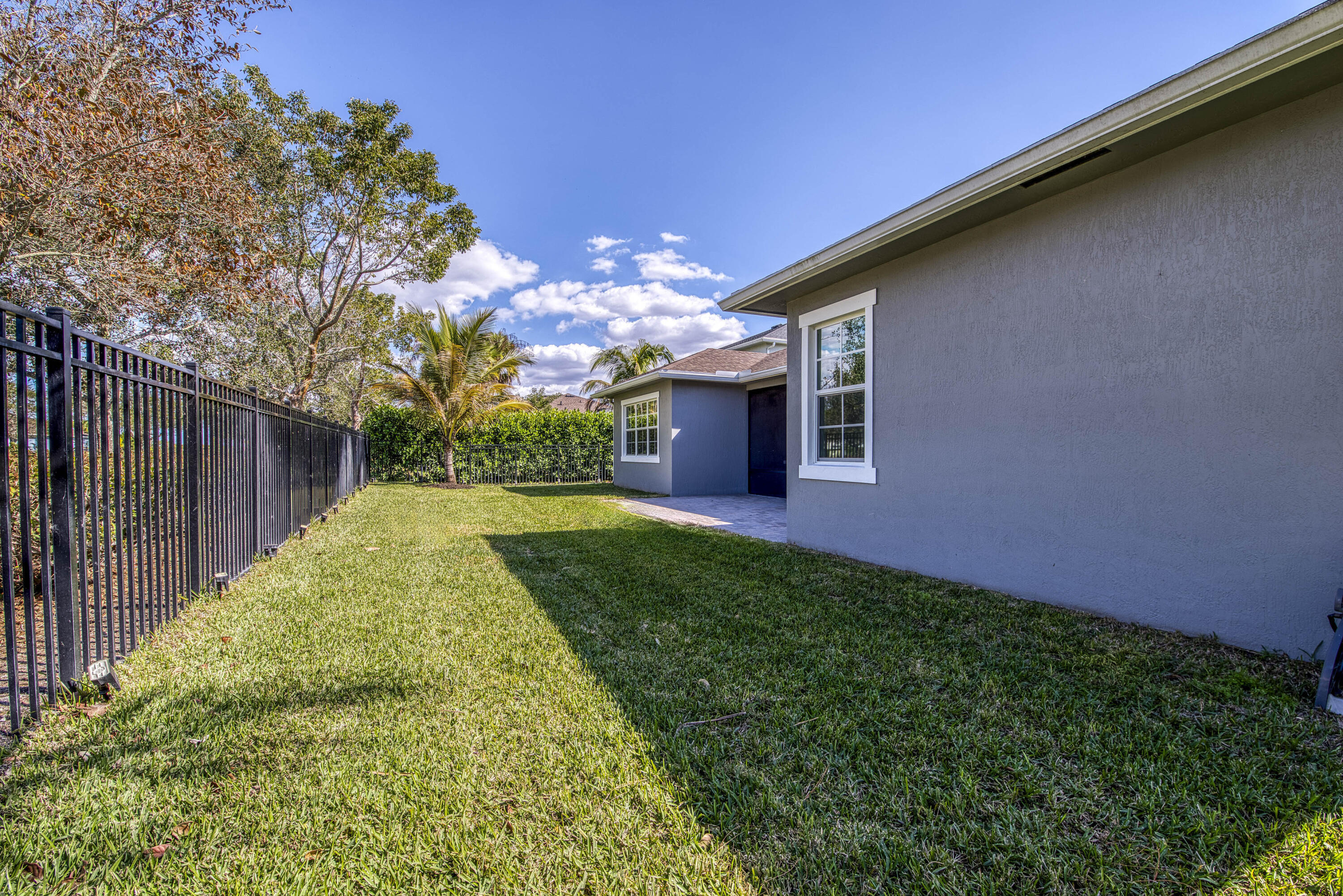 19017 Fly Rod Run Loxahatchee, FL 33470 - Photo 51 of 106 a view of a backyard with plants and large tree