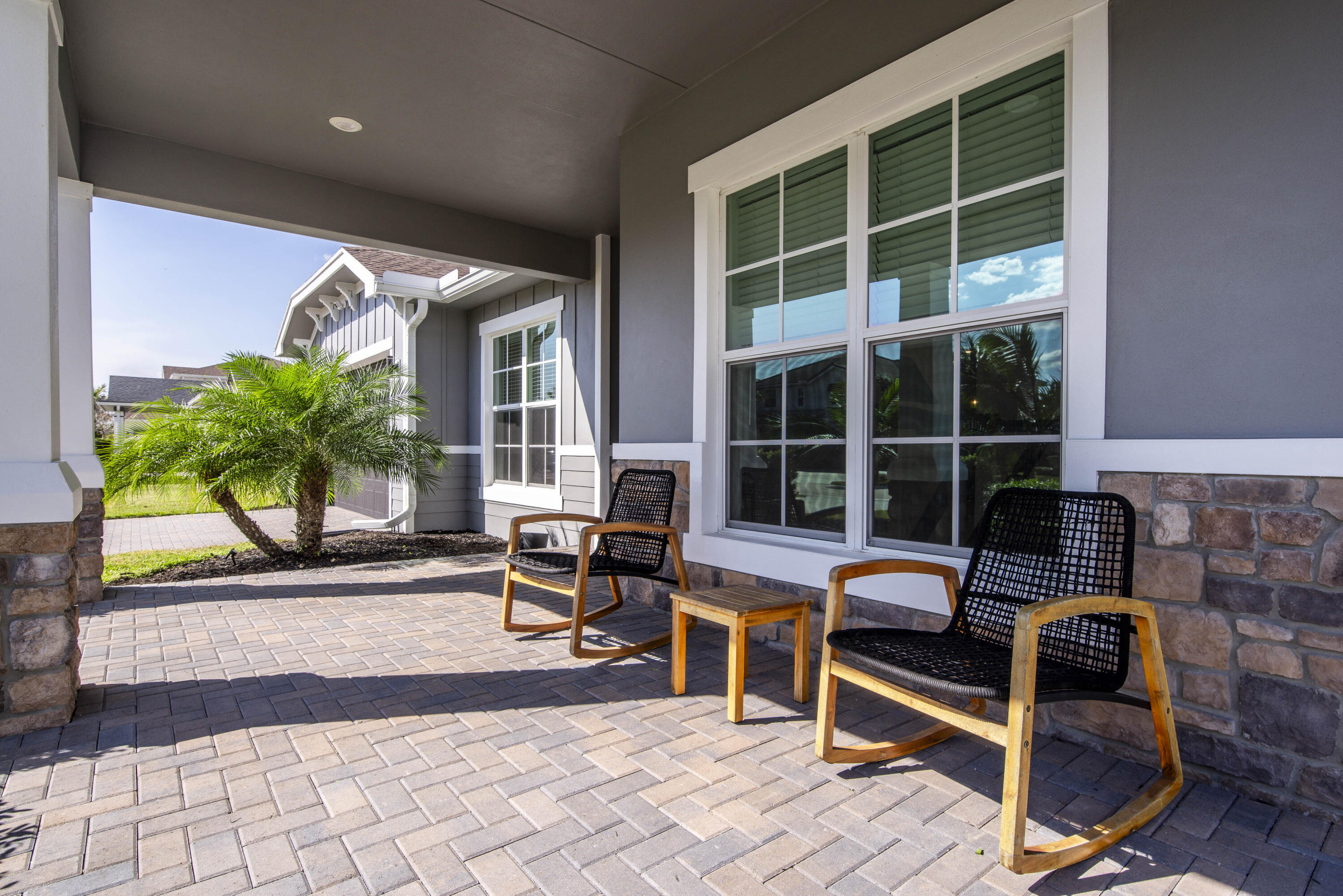 19017 Fly Rod Run Loxahatchee, FL 33470 - Photo 7 of 106 a balcony with furniture and a potted plant