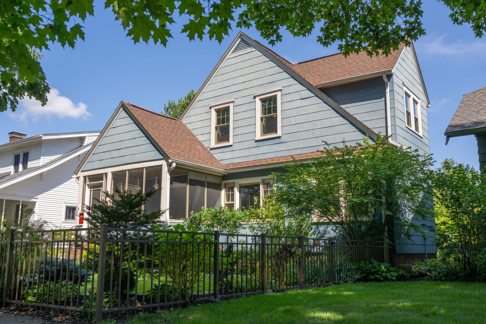 a house that has a tree in front of it