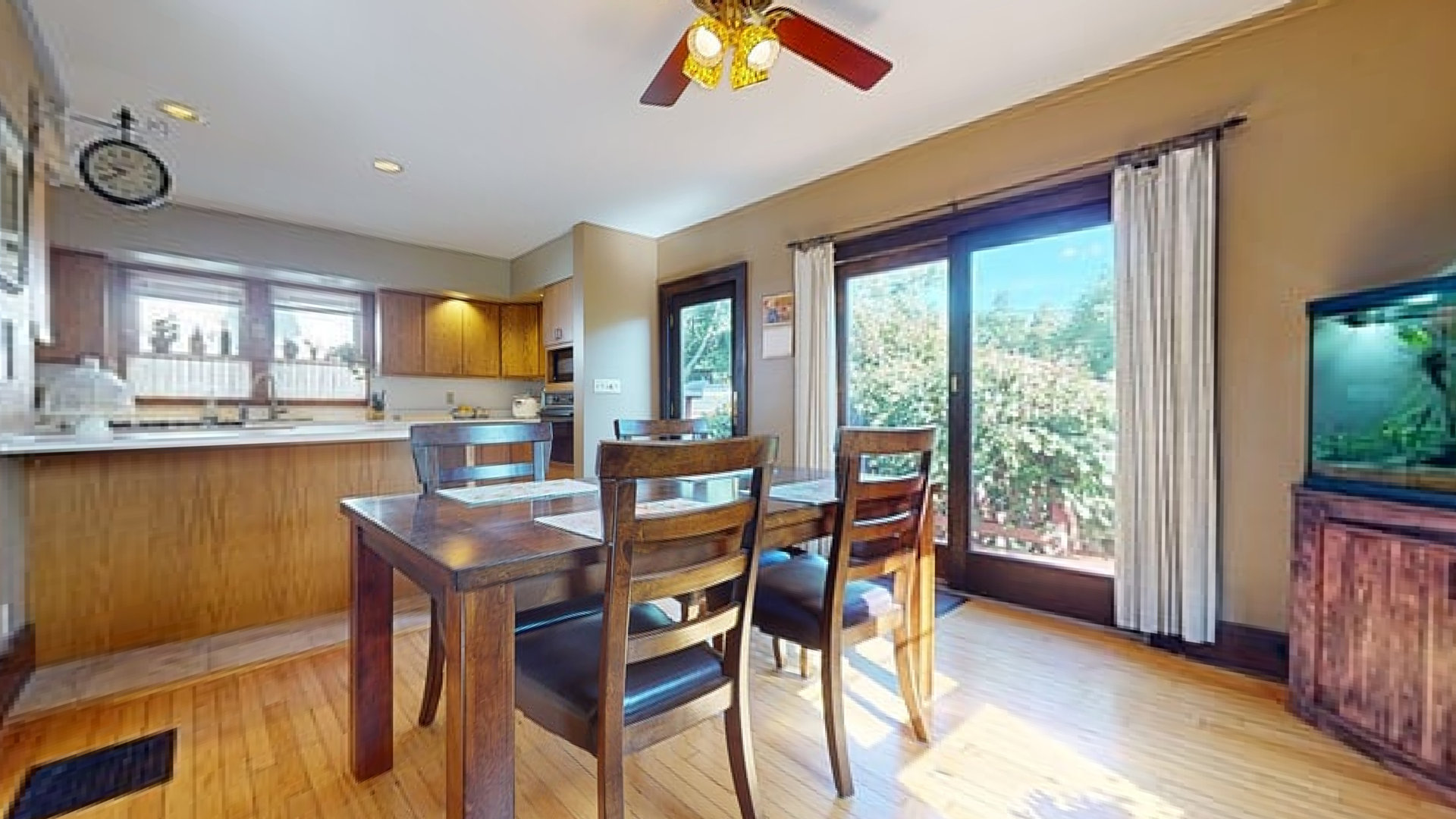 916 West Daniel Street Champaign, IL 61821 - Photo 11 of 46 a dining room with furniture a large window and wooden floor