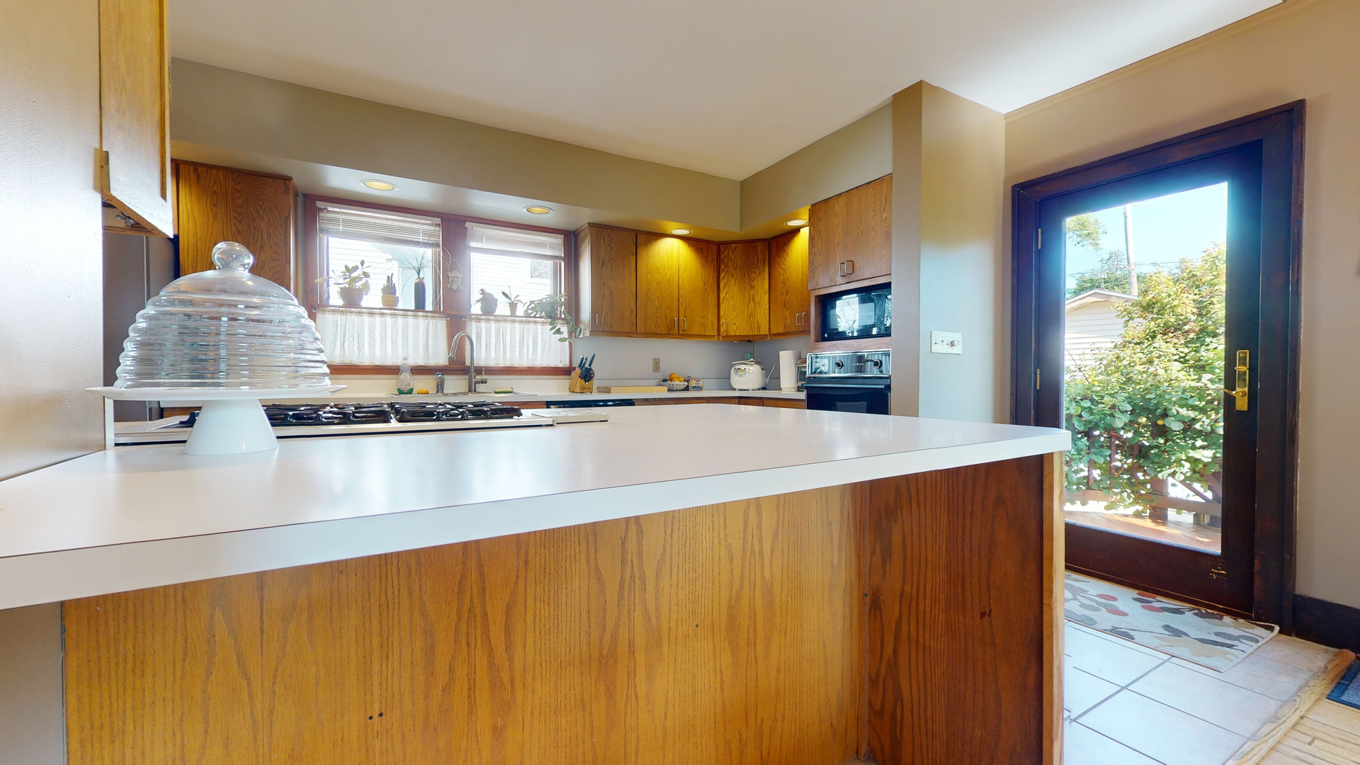 916 West Daniel Street Champaign, IL 61821 - Photo 13 of 46 a kitchen with stainless steel appliances granite countertop a sink and a large window