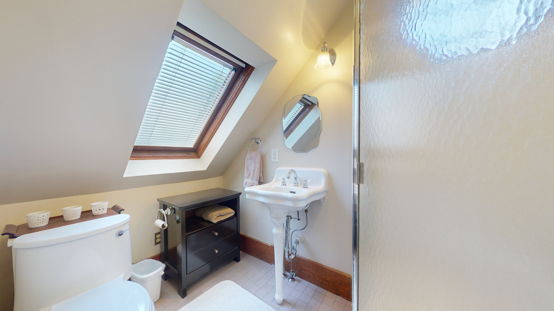 916 West Daniel Street Champaign, IL 61821 - Photo 25 of 46 a bathroom with a sink a toilet and a mirror