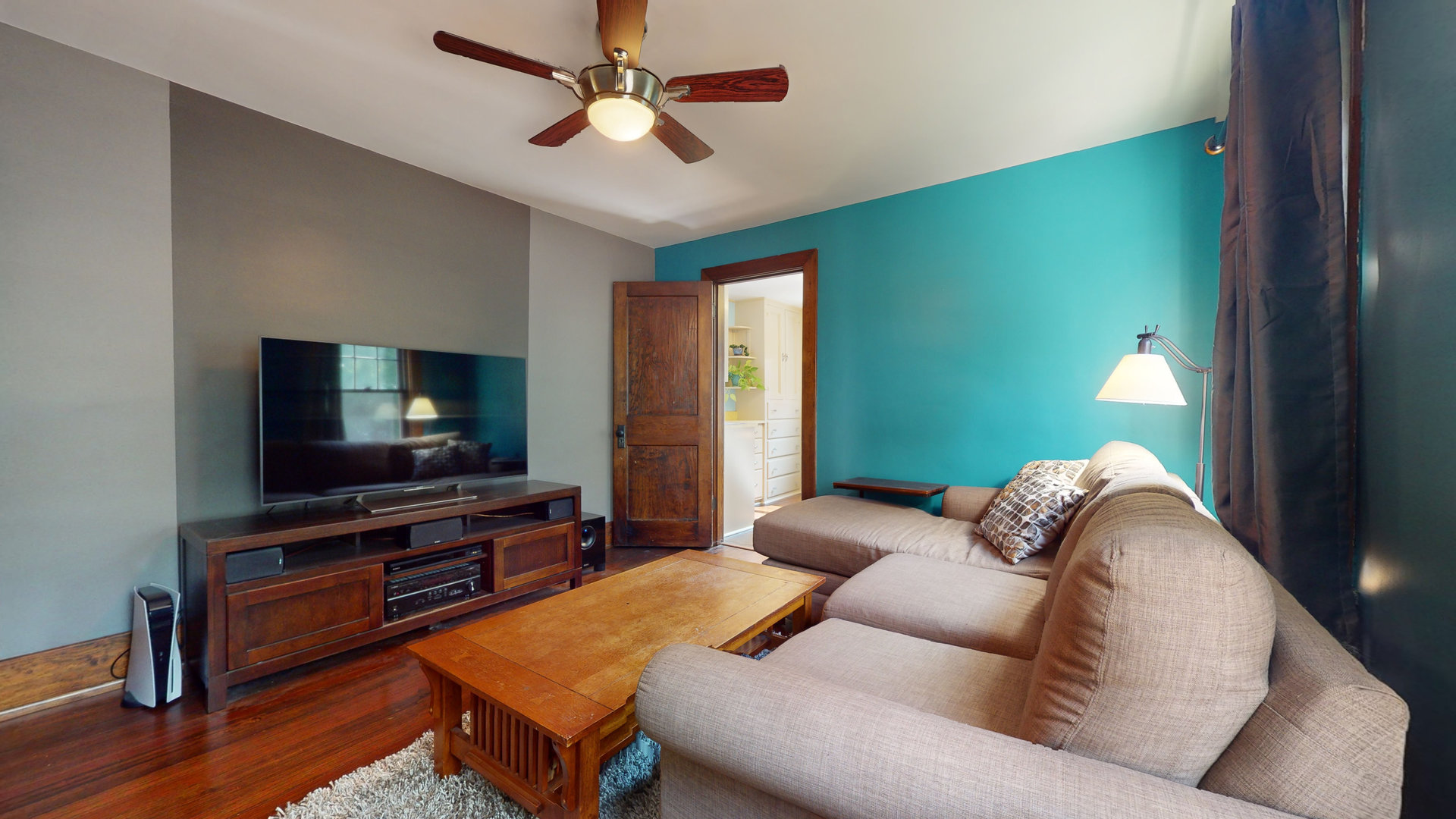 916 West Daniel Street Champaign, IL 61821 - Photo 29 of 46 a living room with furniture and a flat screen tv