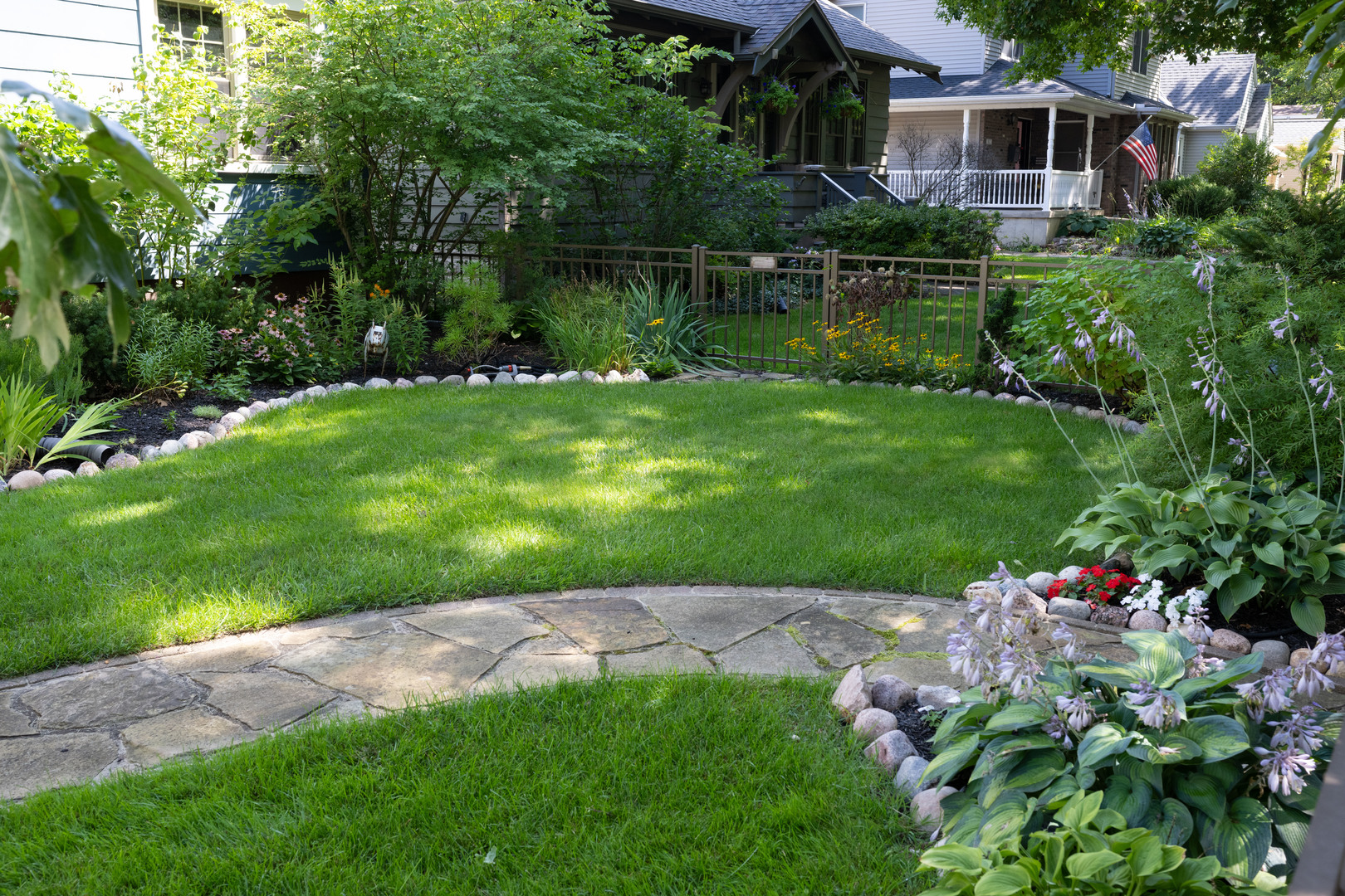 916 West Daniel Street Champaign, IL 61821 - Photo 4 of 46 a view of a garden with a lake