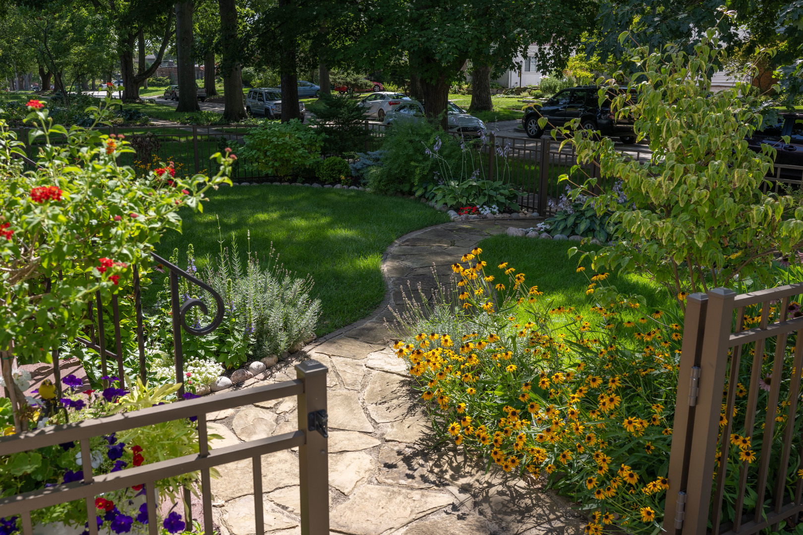 916 West Daniel Street Champaign, IL 61821 - Photo 5 of 46 a backyard of a house with lots of green space and garden
