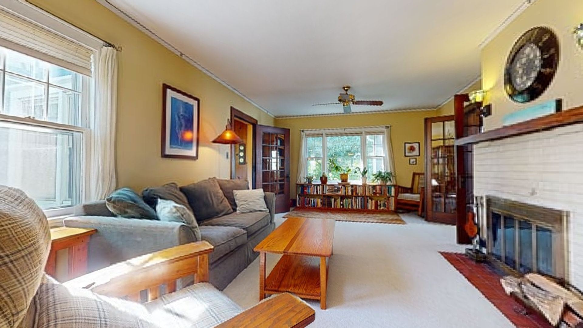 916 West Daniel Street Champaign, IL 61821 - Photo 8 of 46 a living room with furniture a fireplace and a large window