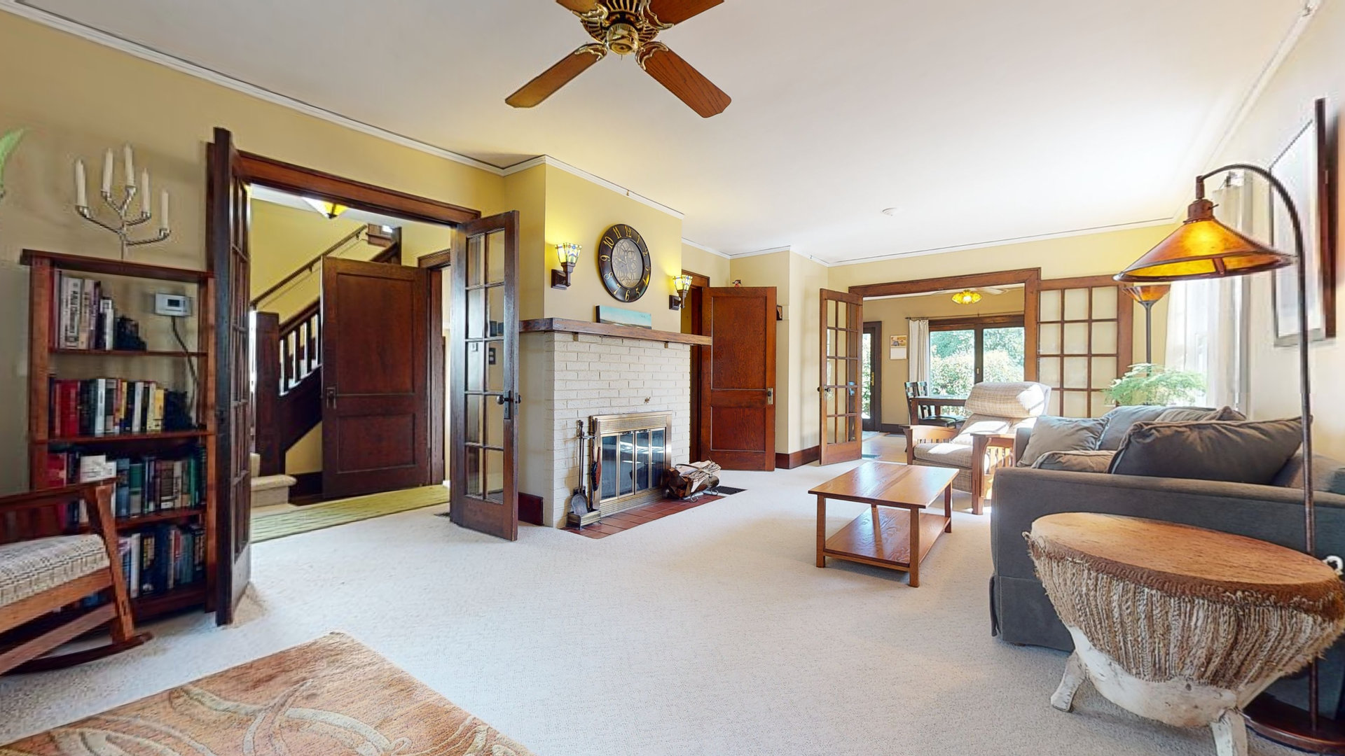 916 West Daniel Street Champaign, IL 61821 - Photo 9 of 46 a living room with furniture a ceiling fan and a window