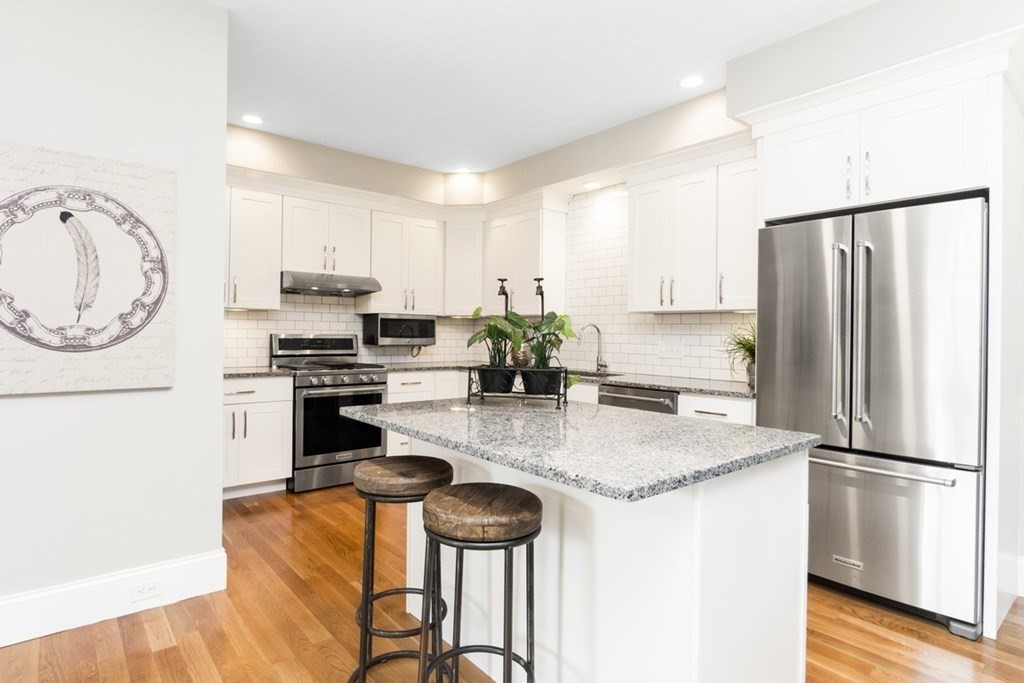 6 Campbell Road, Unit 43 Berlin, MA 01503 - Photo 9 of 18 a kitchen with stainless steel appliances granite countertop a refrigerator a stove a sink and a microwave