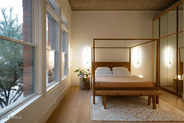 a bed room with a bed and a couch