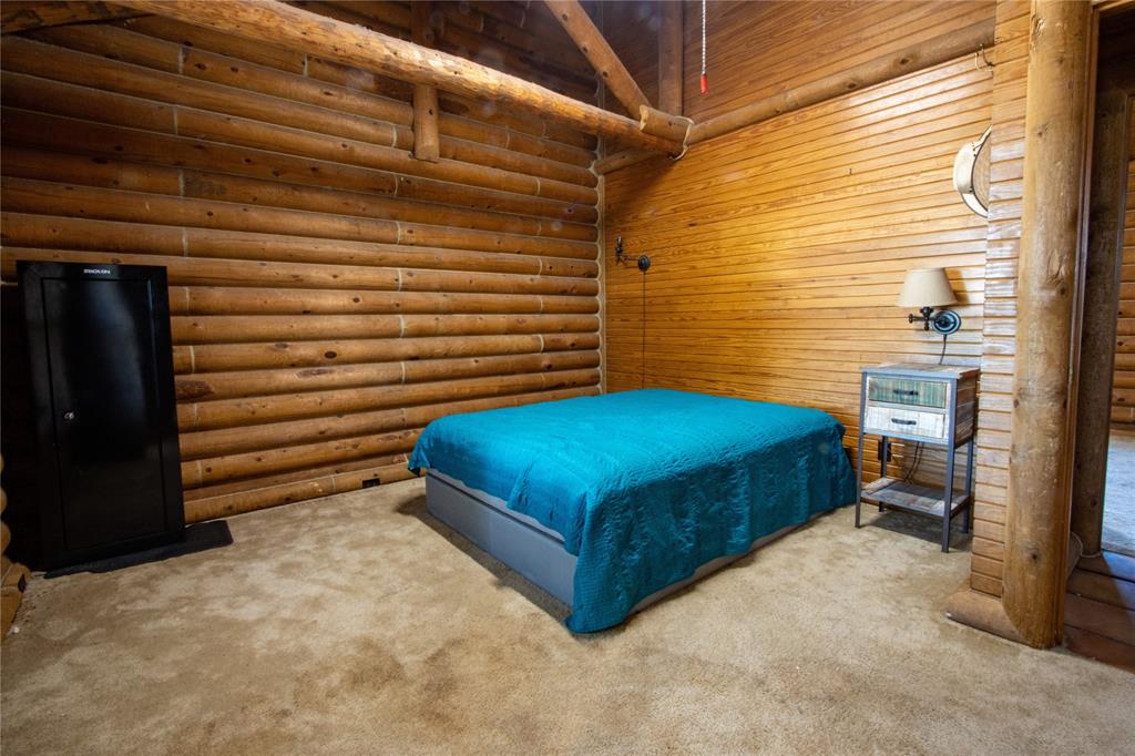 Tbd Vicars Road Bowie, TX 76230 - Photo 24 of 40 a blue bench sitting in middle of a room