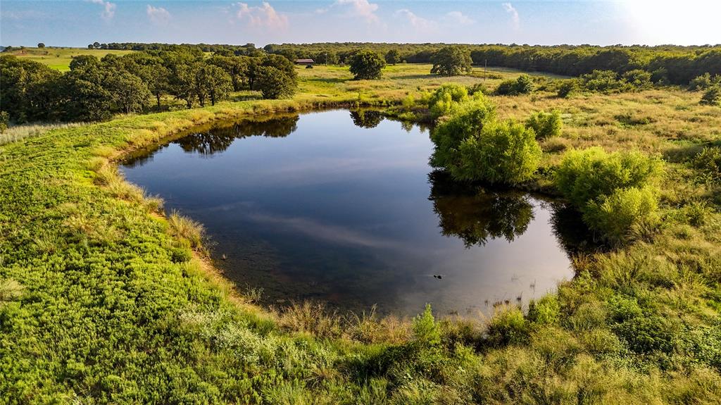 Tbd Vicars Road Bowie, TX 76230 - Photo 3 of 40 a view of a lake with a yard