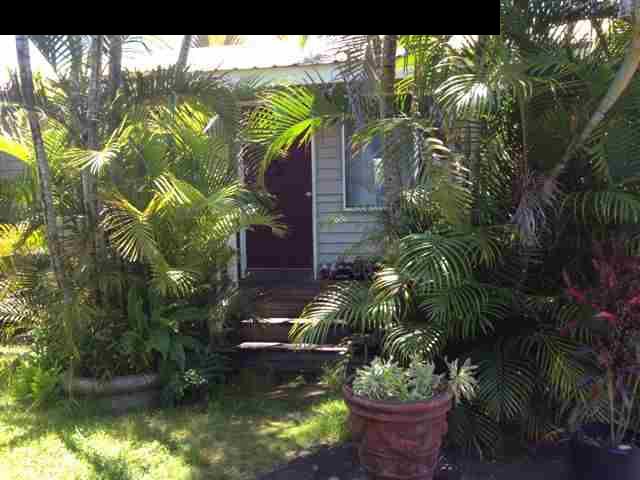 765 Haiku Road Haiku, HI 96708 - Photo 1 of 25 a backyard of a house with lots of green space