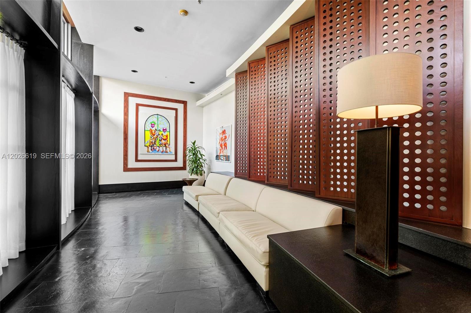 1500 Bay Road, Unit 1268S Miami Beach, FL 33139 - Photo 21 of 31 a living room with furniture and a window