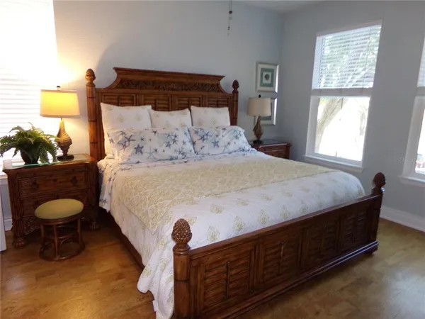 a bedroom with a bed and window