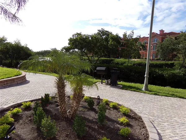 a view of a garden with a lake view