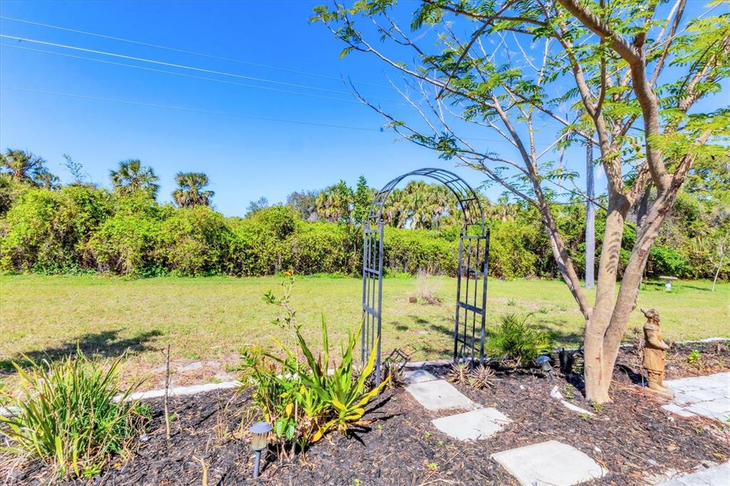 985 Jolanda Circle Venice, FL 34285 - Photo 31 of 49 a view of a lake with a big yard