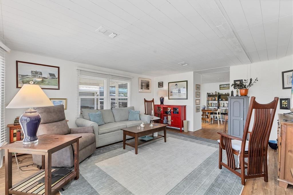 985 Jolanda Circle Venice, FL 34285 - Photo 6 of 49 a living room with furniture and a wooden floor