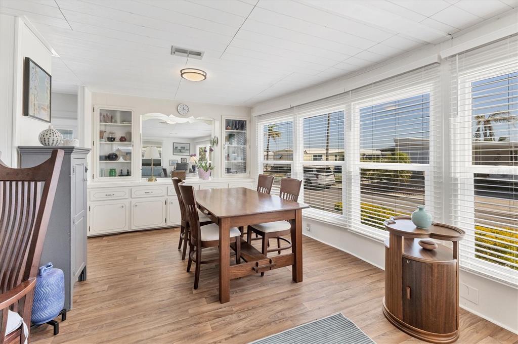 985 Jolanda Circle Venice, FL 34285 - Photo 9 of 49 a dining room with furniture and wooden floor