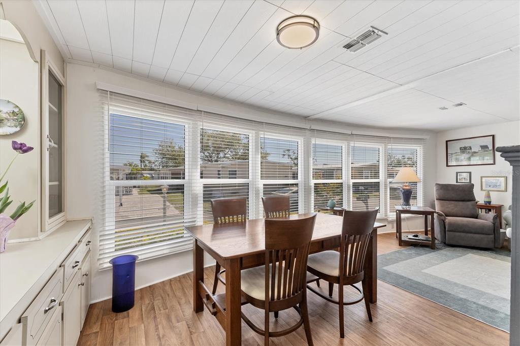 985 Jolanda Circle Venice, FL 34285 - Photo 10 of 49 a view of a dining room with furniture window and wooden floor