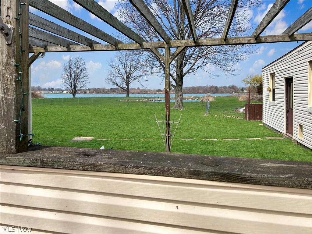 4663 East Harbor Road Port Clinton, OH 43452 - Photo 26 of 31 View of yard with a water view and a pergola