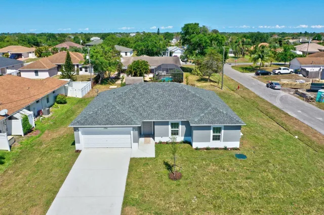 an aerial view of a house having swimming pool