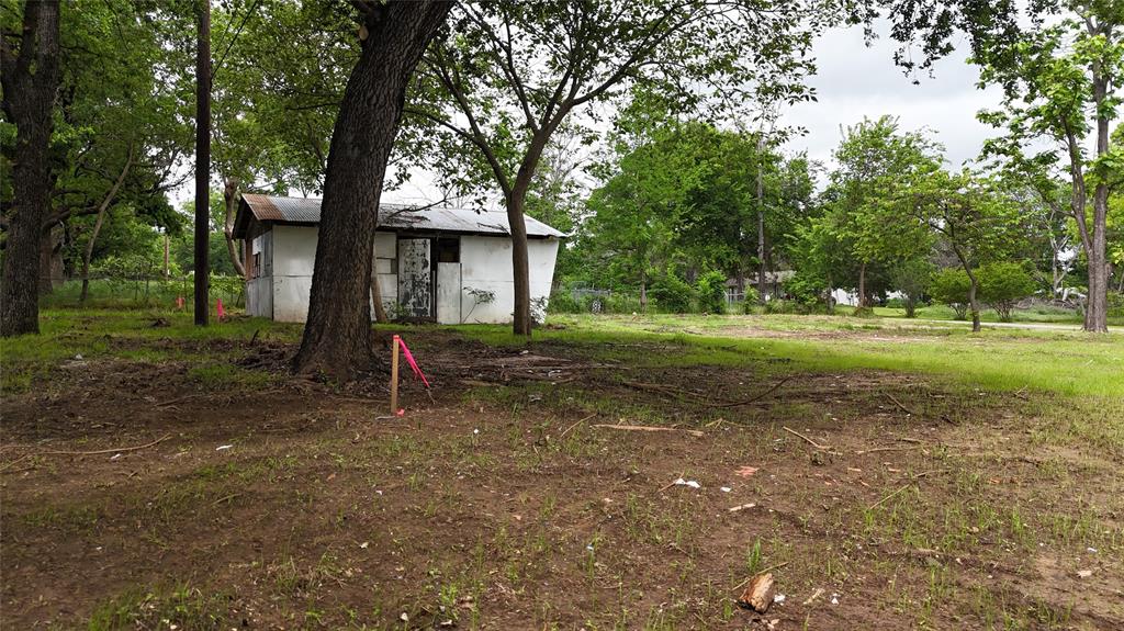 7151 Alcove Street Azle, TX 76020 - Photo 13 of 15 a view of a house with a yard and tree s