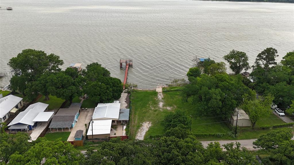 7151 Alcove Street Azle, TX 76020 - Photo 14 of 15 an aerial view of a house with a yard and lake view