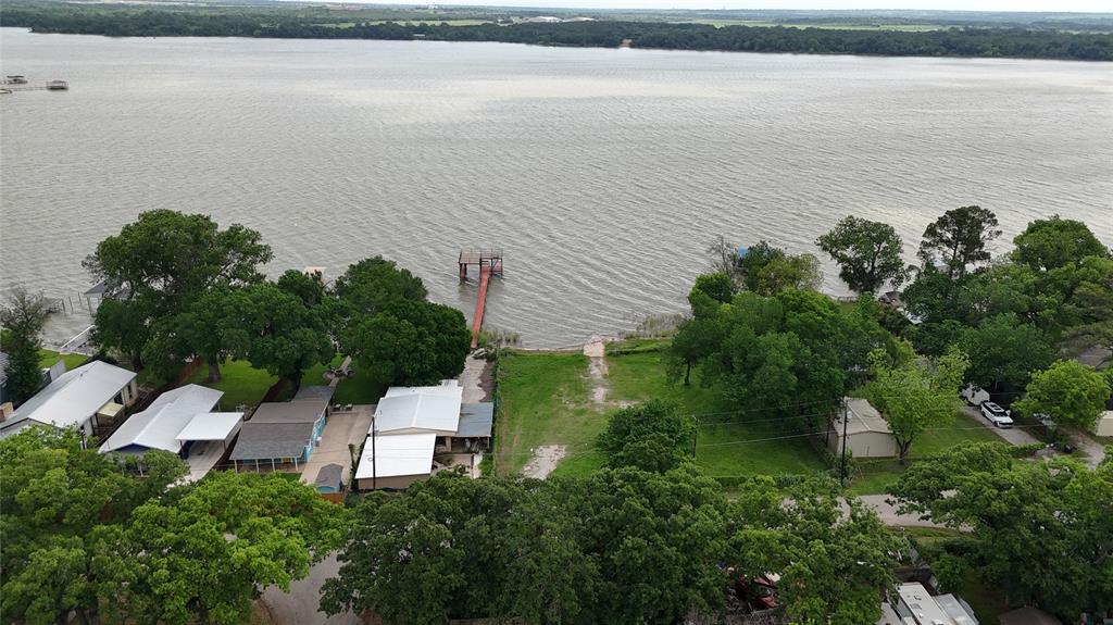 7151 Alcove Street Azle, TX 76020 - Photo 15 of 15 a picture of a lake with a building in front of it