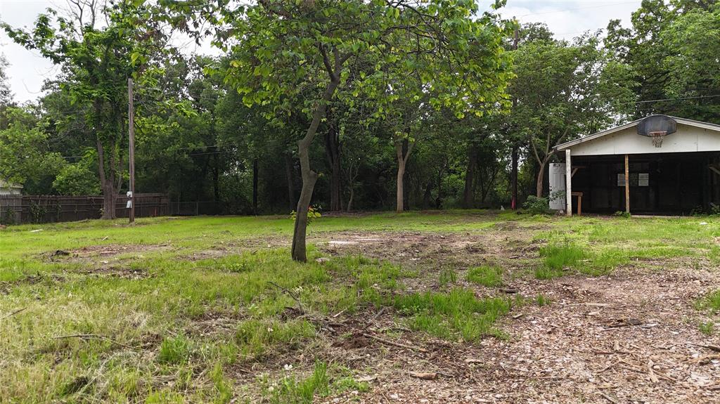 7151 Alcove Street Azle, TX 76020 - Photo 5 of 15 a backyard of a house with lots of green space