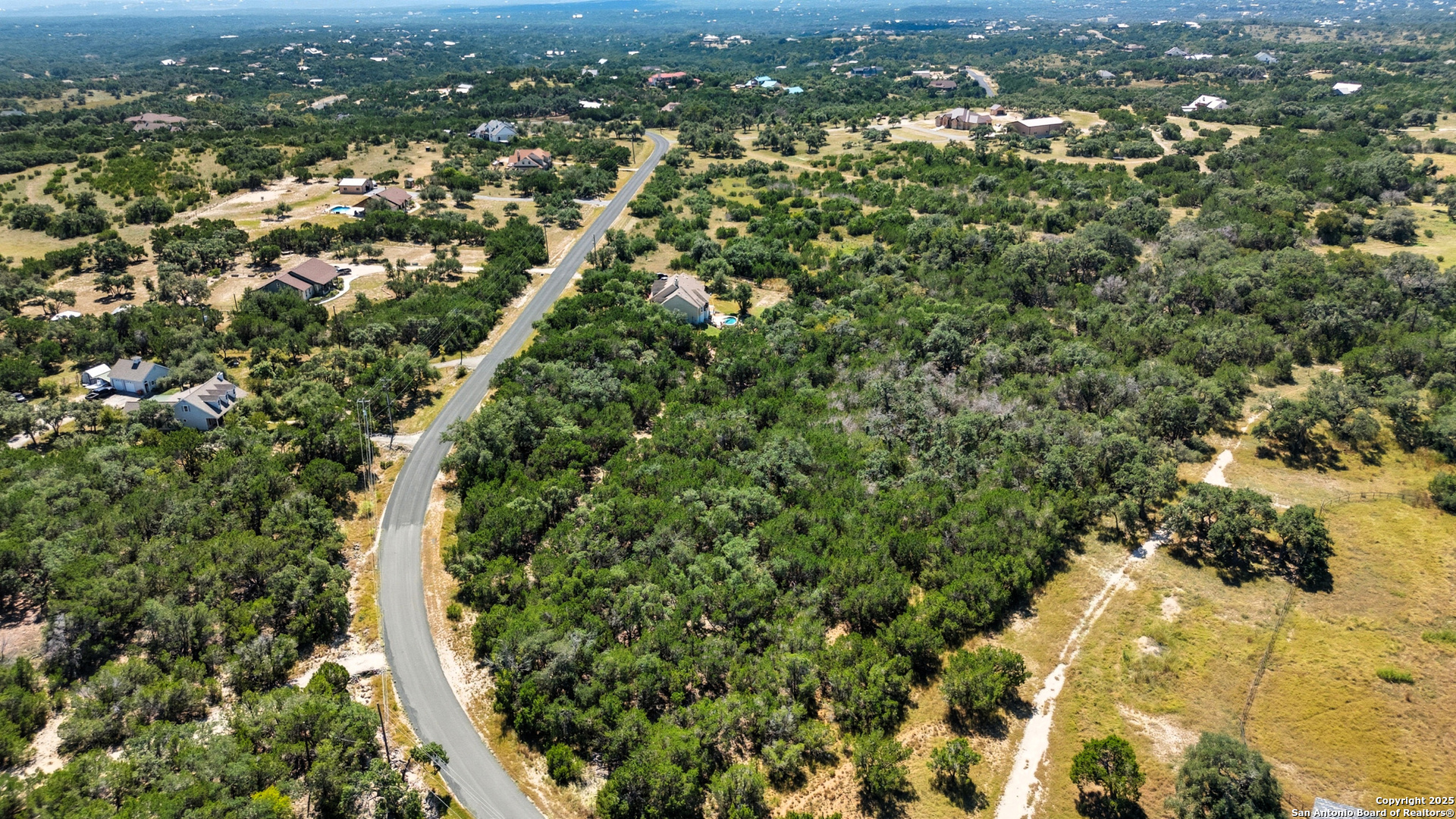 0 North Stallion Ests Drive Spring Branch, TX 78070 - Photo 14 of 17 an aerial view of residential houses with city and green space