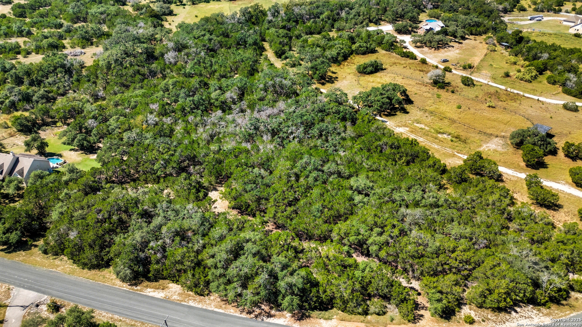 0 North Stallion Ests Drive Spring Branch, TX 78070 - Photo 16 of 17 a view of a green yard