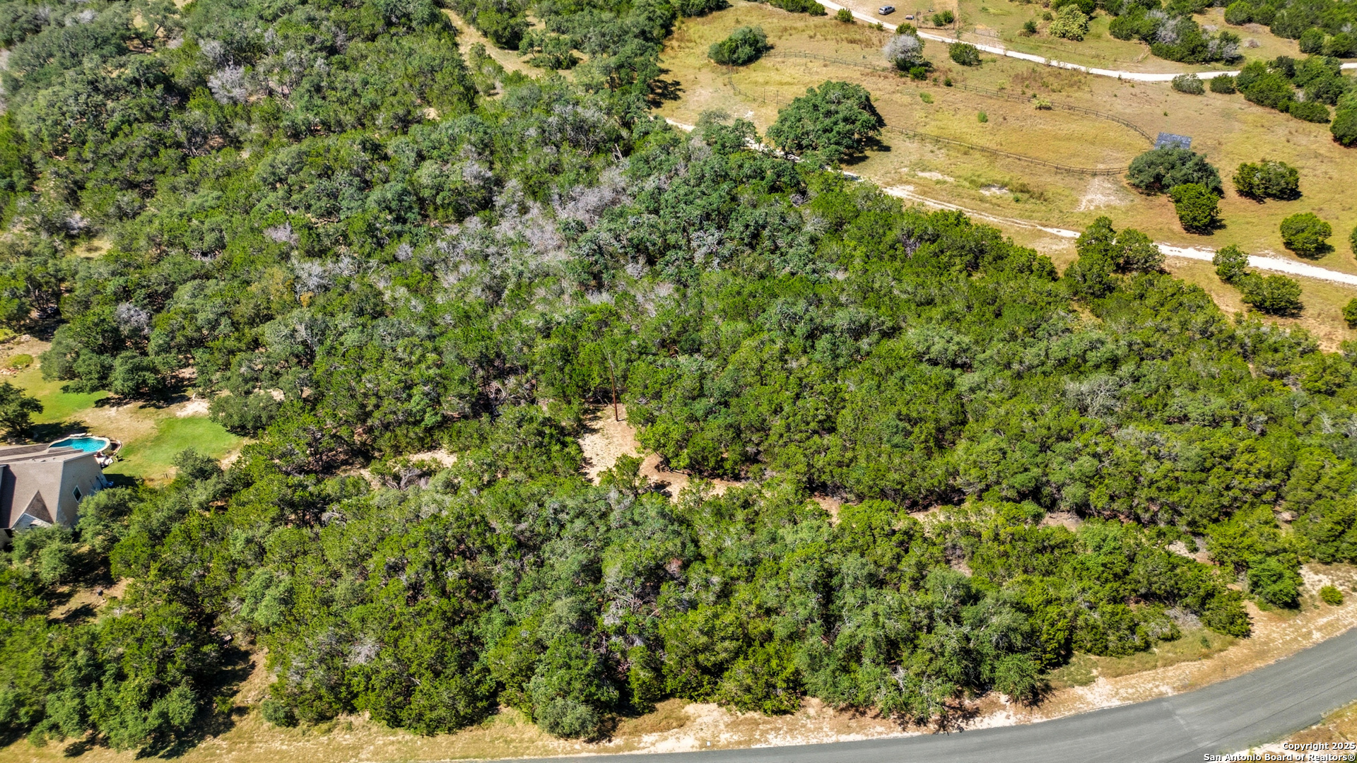 0 North Stallion Ests Drive Spring Branch, TX 78070 - Photo 17 of 17 a view of a bunch of trees in a yard